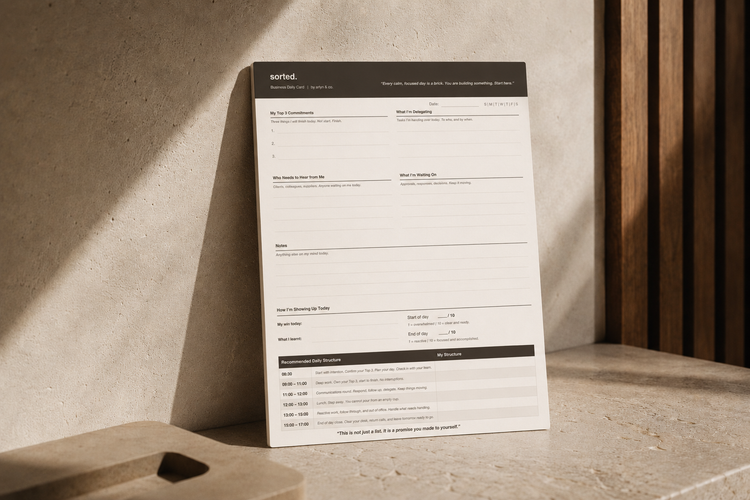 Sorted. edition Business Daily Card by arlyn & co. styled in a warm minimalist architectural workspace with soft natural light, showcasing calm structured daily planning and intentional living.
