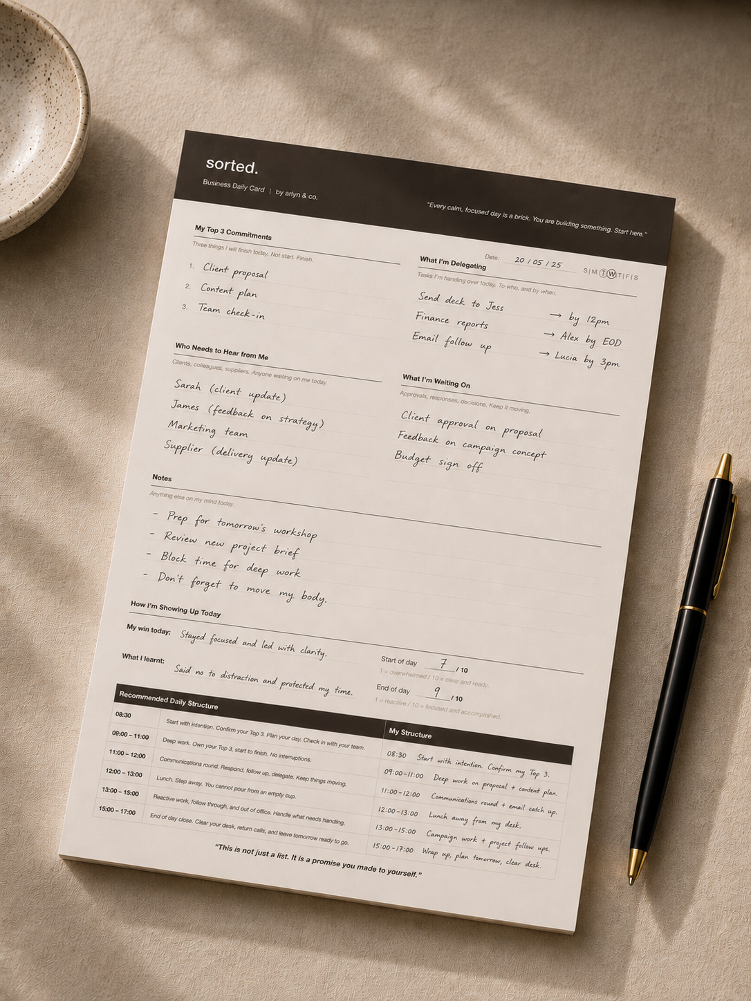 Filled out Sorted. Business Daily Card on a calm neutral desk showing intentional daily planning and structure.
